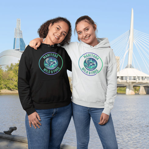 Embrace the magic of the prairies with our Manitoba – Wild & Free hoodie, featuring a captivating graphic of a snowy owl in flight beneath the shimmering northern lights.